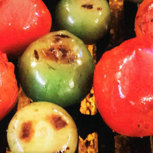 Fire-roasted tomatoes and tomatillos on a grill, perfect for barbecue salsa by Chef Rays LLC