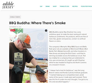 Man slicing barbecue ribs at outdoor event, wearing BBQ Buddha shirt and hat, featured in Chef Rays LLC grilling article.