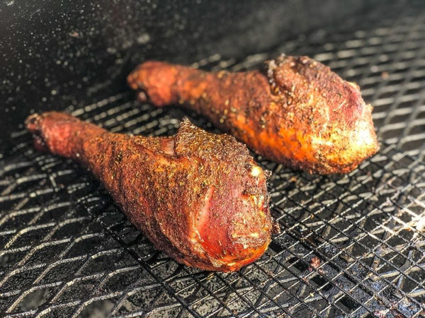 Smoked turkey legs seasoned and grilled on a barbecue for Chef Rays LLC