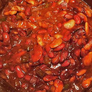 Close-up of barbecue baked beans in savory sauce, Chef Rays LLC healthy grilling recipe.
