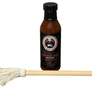 Chef Ray Sheehan Memphis Mop BBQ sauce bottle with a wooden barbecue mop brush