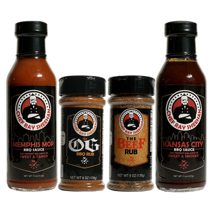 Four Chef Ray Sheehan seasoning and sauce products arranged on a transparent background: a Memphis Mop BBQ Sauce bottle, a OG BBQ Rub jar, a Beef Rub jar, and a Kansas City BBQ Sauce bottle.