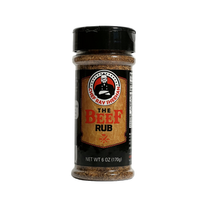 A 6 oz plastic bottle of Chef Ray Sheehan's 'The Beef Rub' seasoning, featuring a black cap and a black label with a gold and red design, isolated on a transparent background.